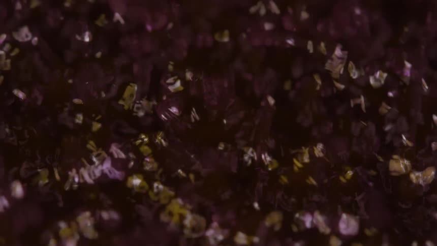 Black yellow and pink colors that look like water rippling