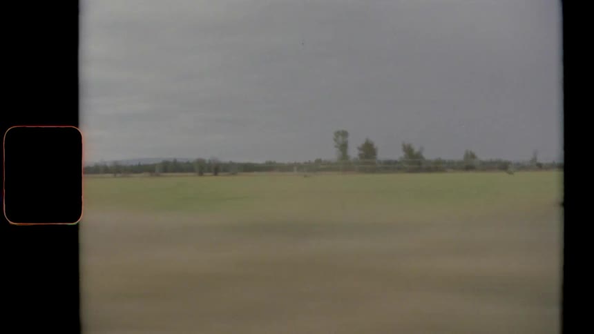 Rural farmland and landscape from moving vehicle