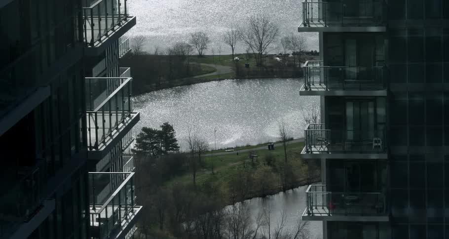 Buildings are surounded by a lake and nature