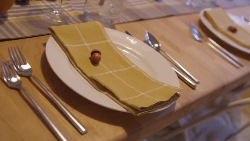 Plates and silverware on a set dinner table