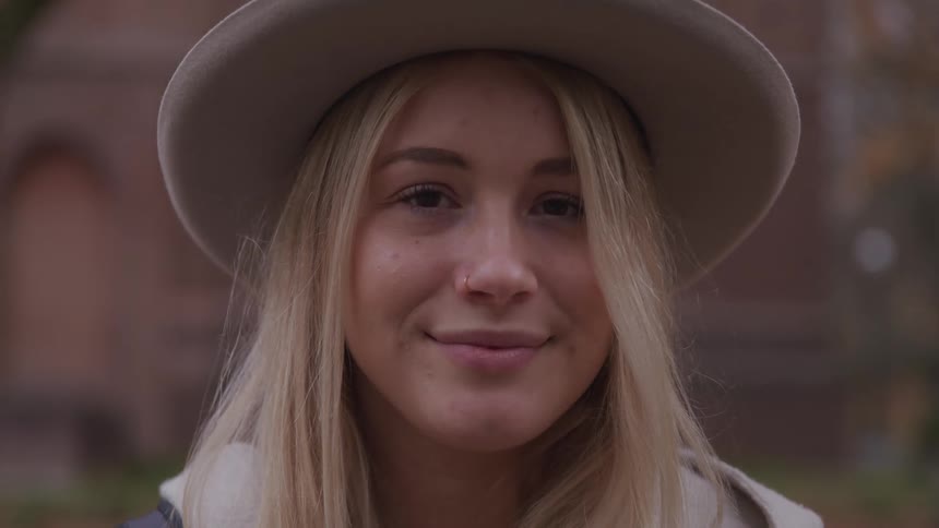 A teenage girl smiles for a photo