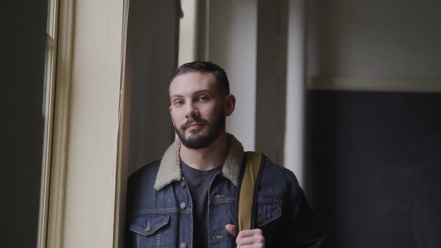 A man is standing inside of a building