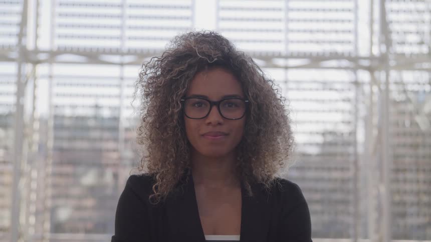 Young woman in glasses smiles