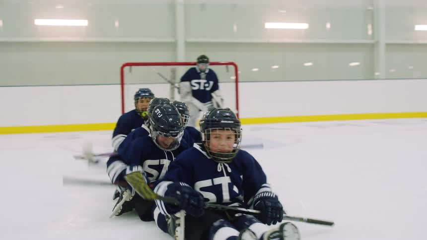 Kids hockey team practicing on skating rink