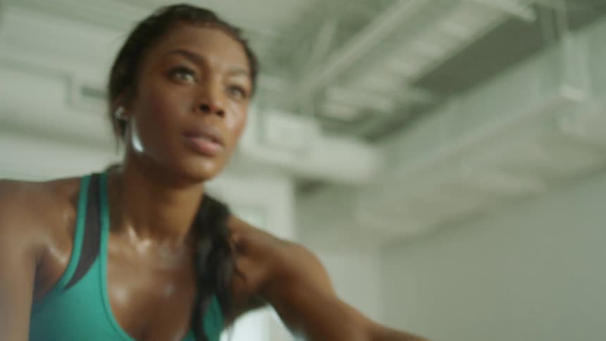 A woman exercising on a stationary bike