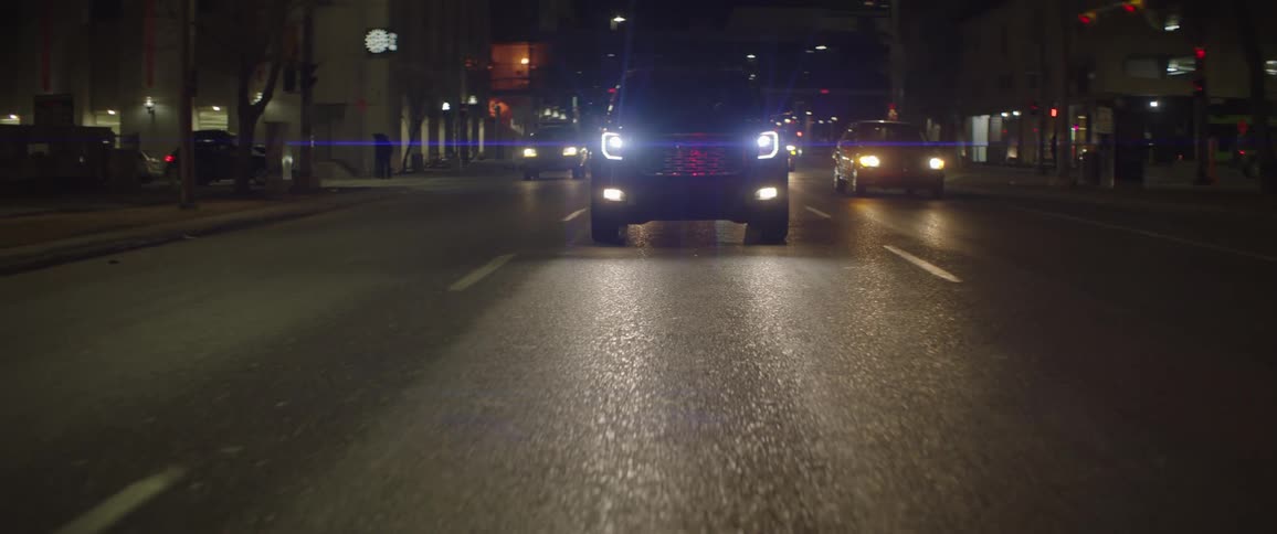 Car driving at night in the city