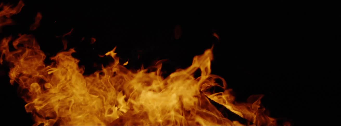 A fire is burning at night