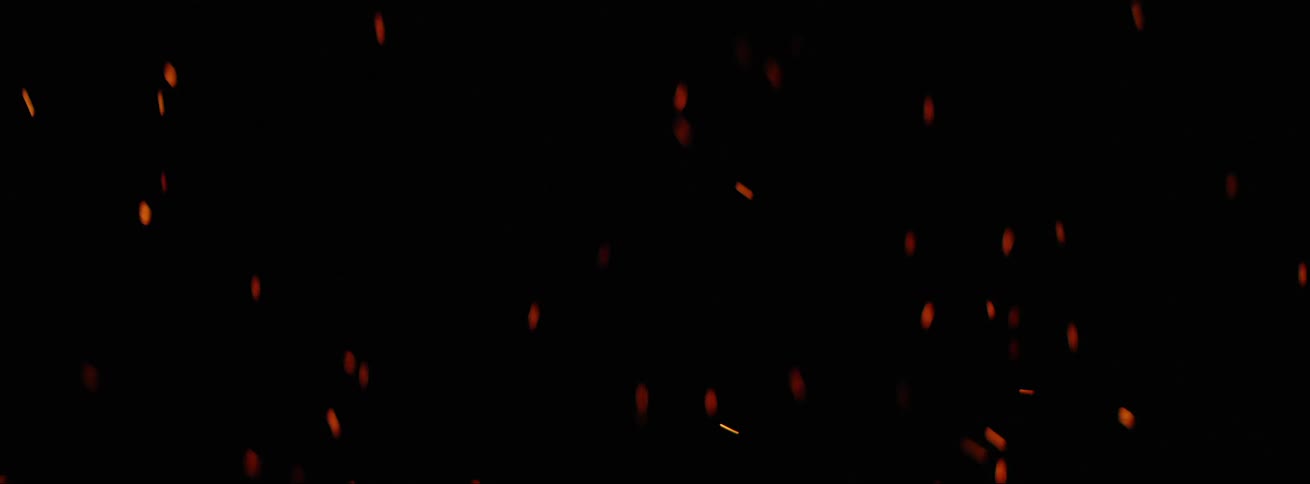 Sparks from fire flying in to the air