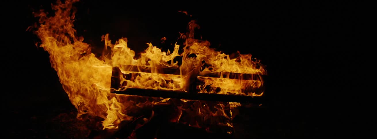 A box frame item is in flames on a burning fire