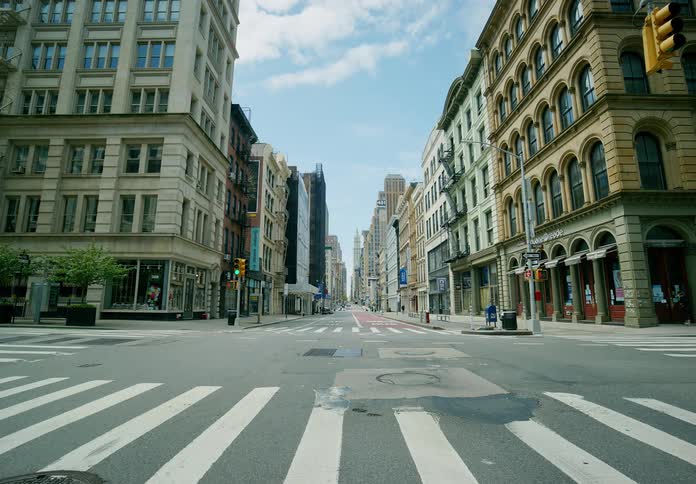 A downtown city area with traffic and people