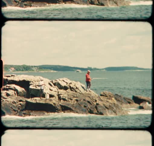 A man fishes off of the rocky coast of Maine