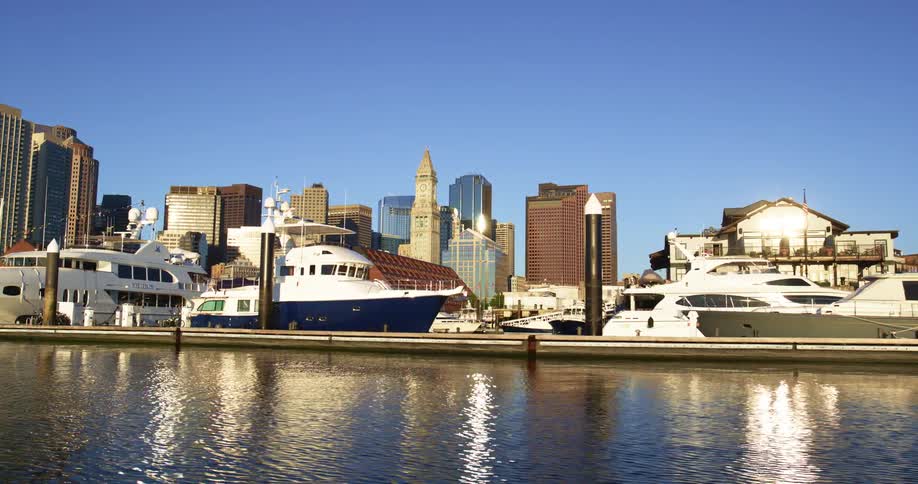 Cruising by yachts docked on the marina in the city