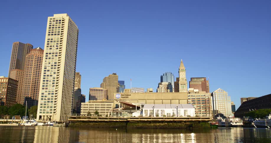 A skyline is displayed by the ocean