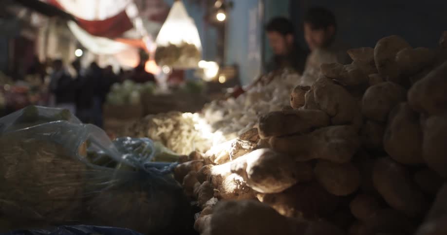 The market is busy with many items for sale