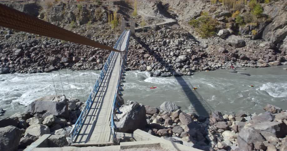 A river flowing under a bridge in the daytime