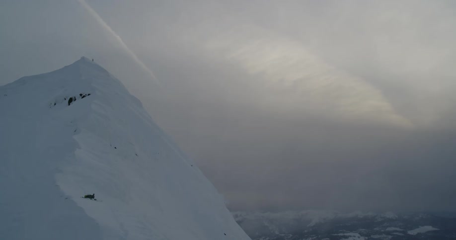 Mountain peak in front of heavy cloud cover at dusk