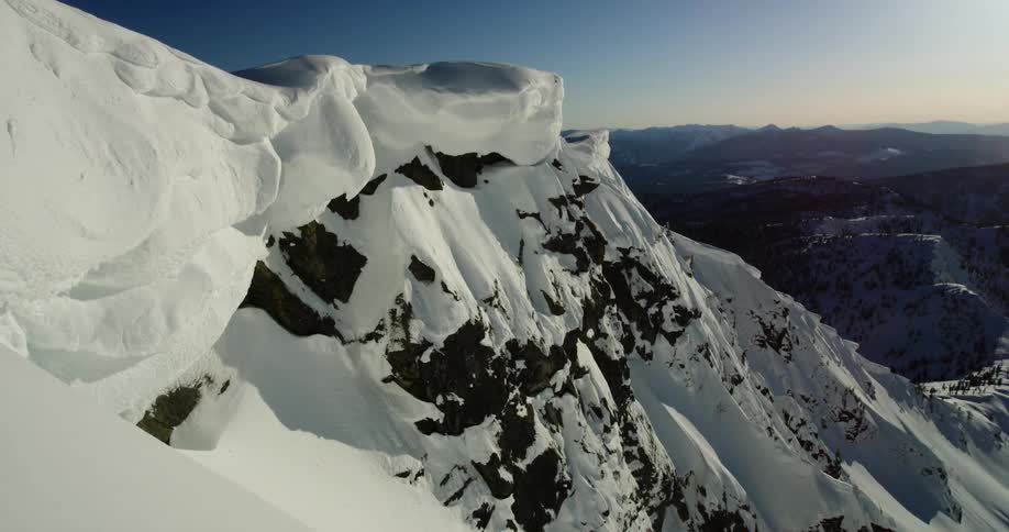 The tall mountains are covered with snow