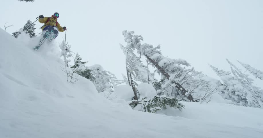 A skier jumps off a small lift
