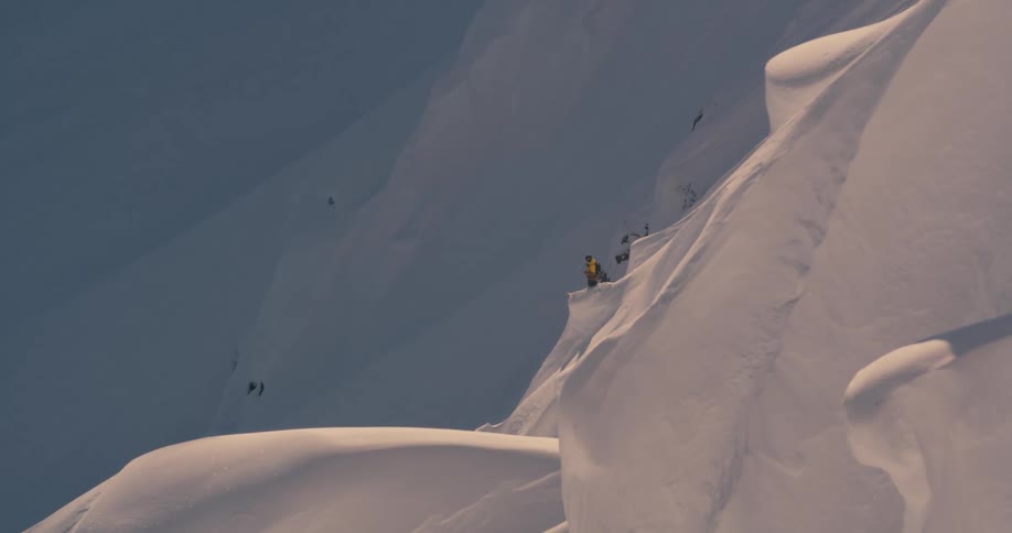 People on a snowy mountain hiking in the snow