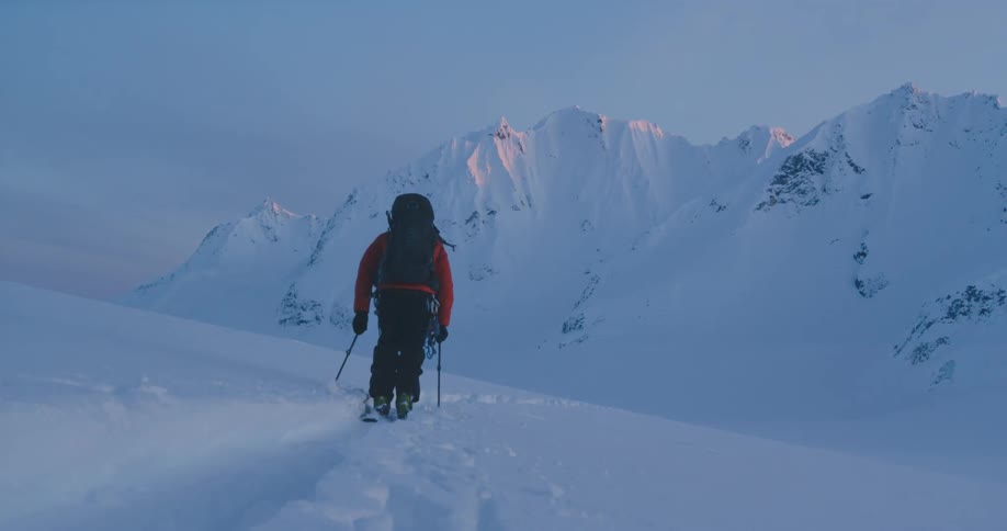 A person skiing in the mountains