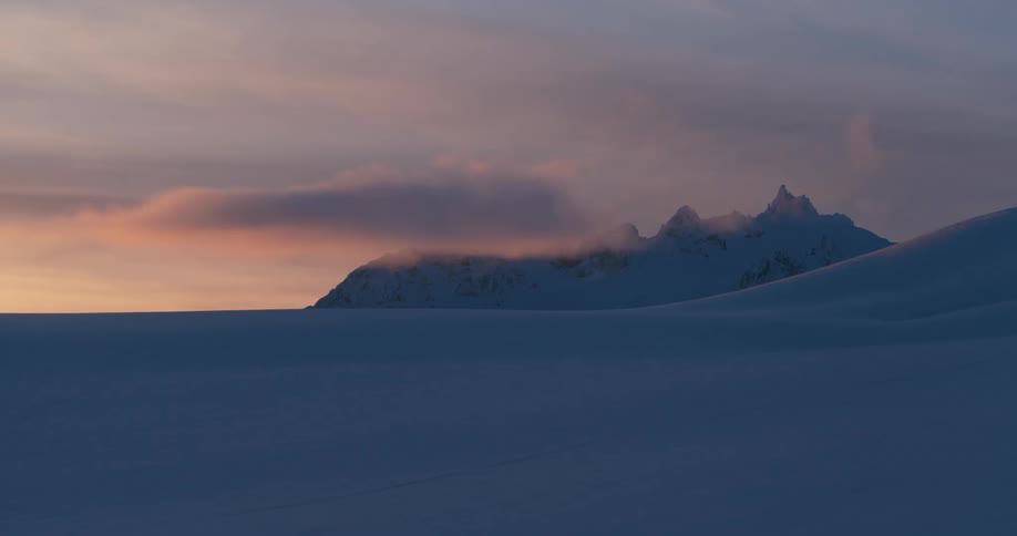 The sun is setting in an arctic area
