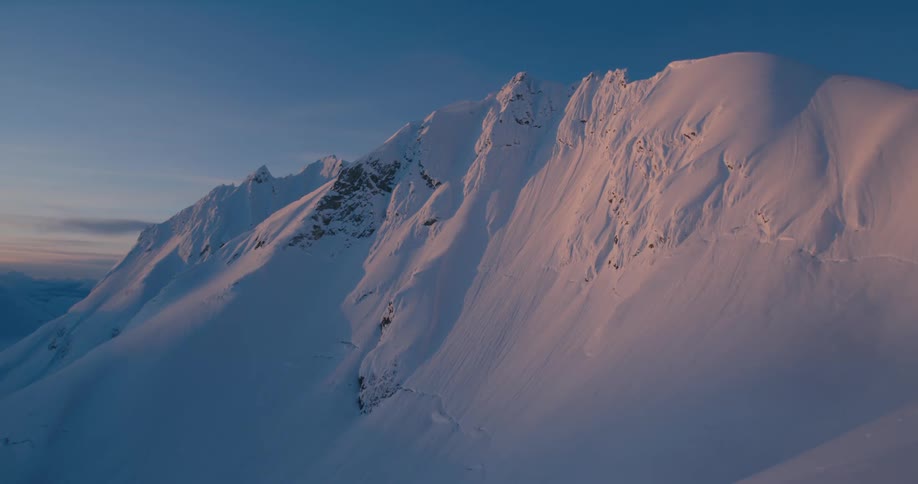 A snowy mountain range in the wilderness