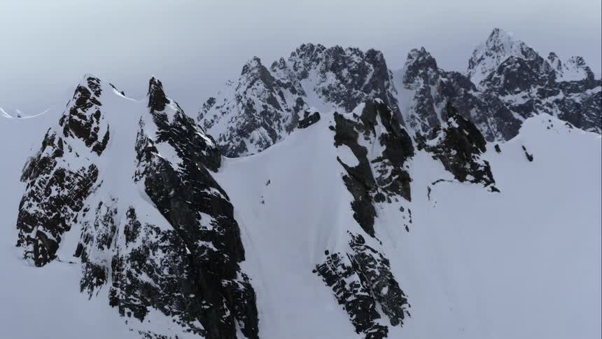Aerial of winter mountain ranges