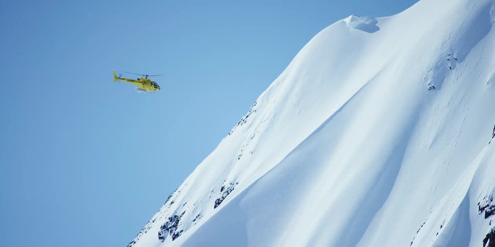 A helicopter is flying in an arctic area