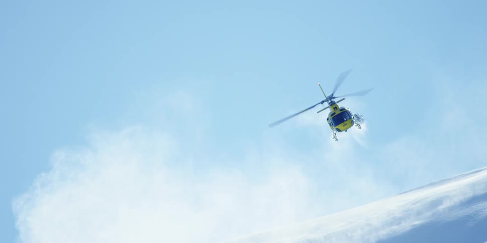 A helicopter is flying in an arctic area