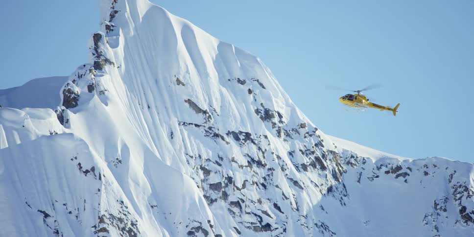 A helicopter is flying in an arctic area