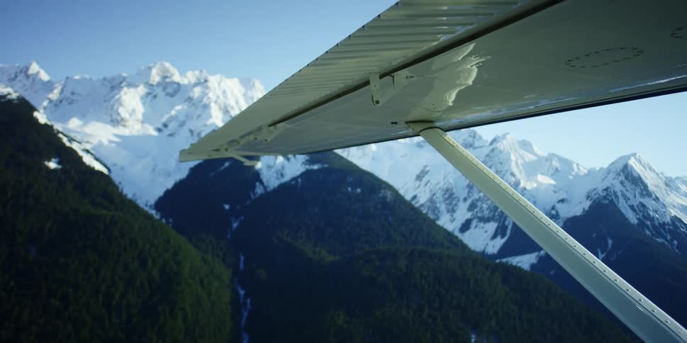 Aerial view of snow capped mountain range seen from a plane