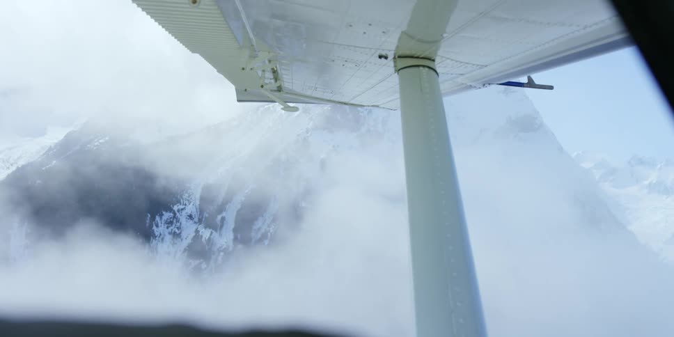 Aerial view of snow capped mountains seen from a plane
