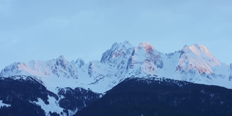A snow covered mountain is displayed