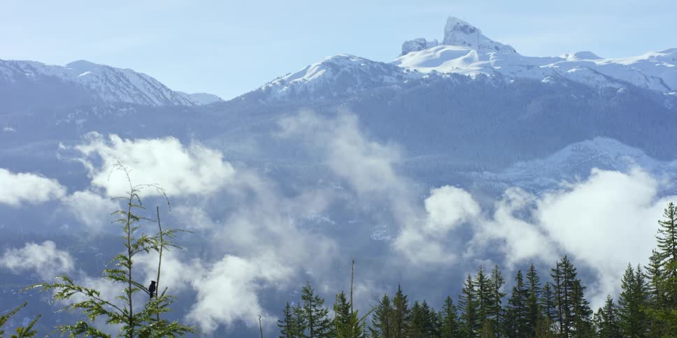 An aerial view of a mountain is displayed
