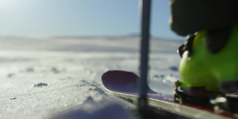 A skier is traveling over the ice