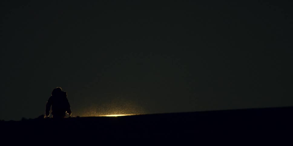 A person is hiking at night