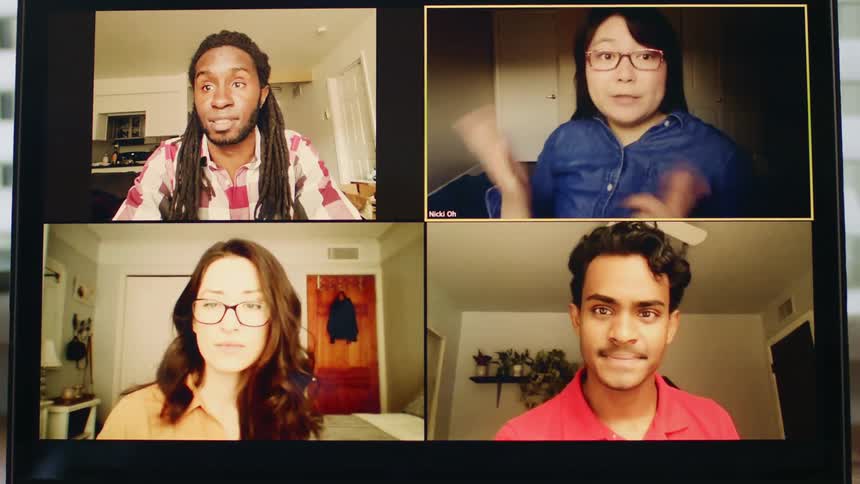 A computer screen with four people video chatting at home