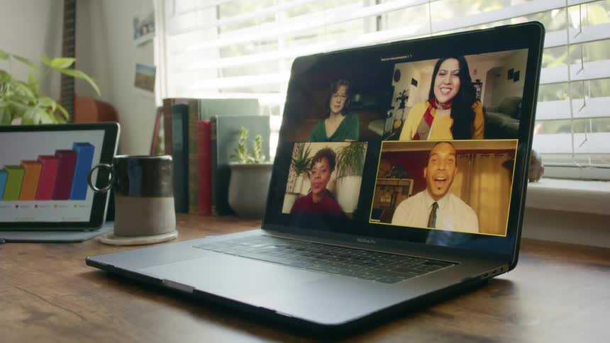 A laptop with people video chatting