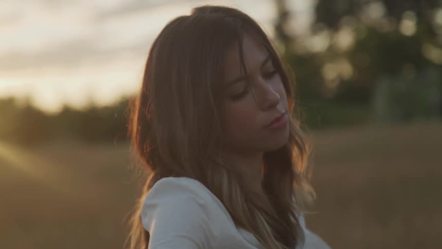 A woman swaying in a field