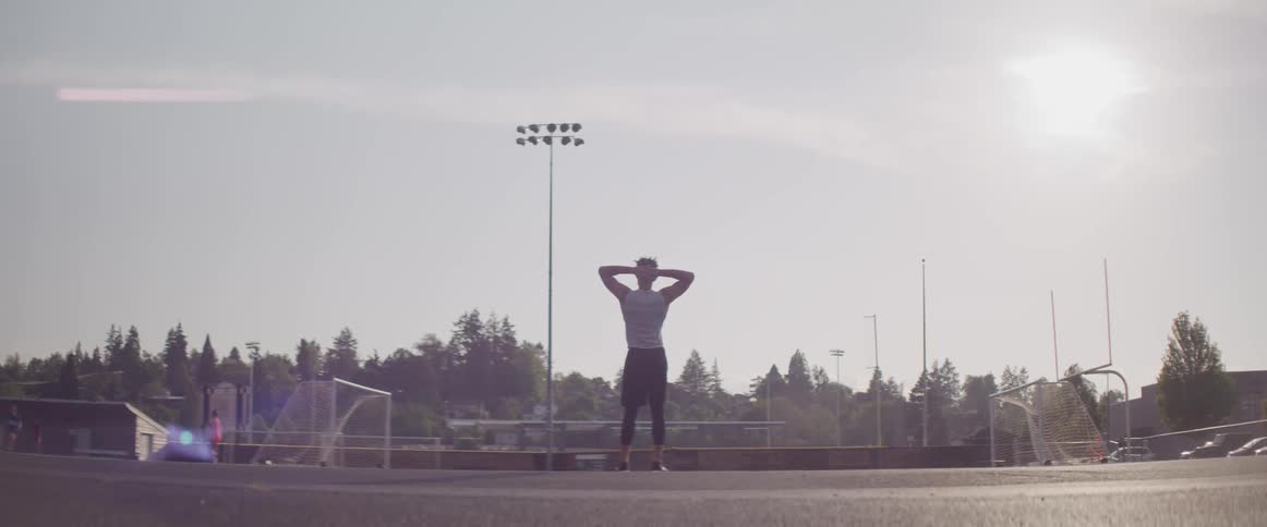 A teenage boy watching a soccer game