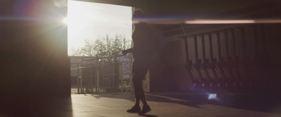 A man is jumping rope in a gym