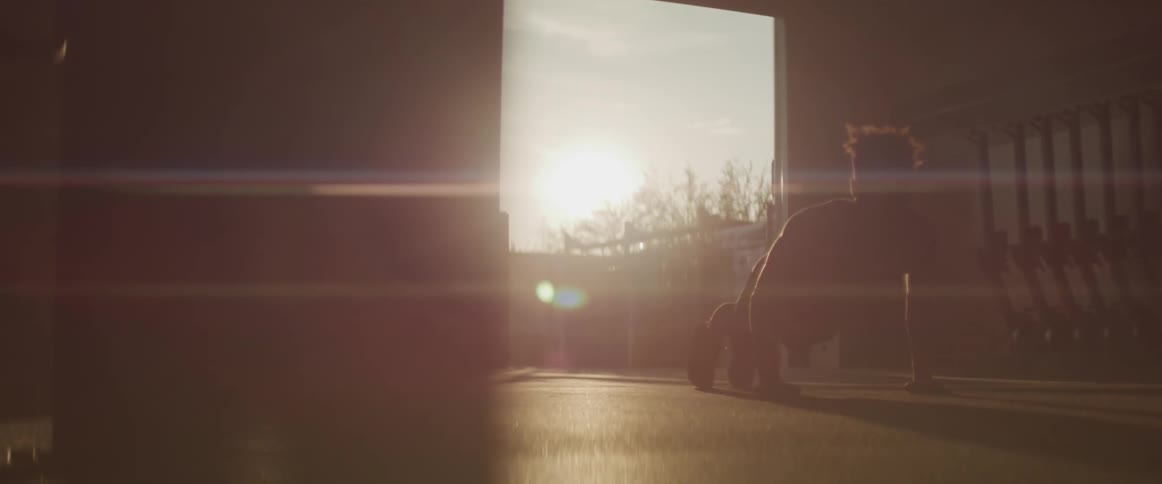 A young man does a series of push ups in quick succession in front of an open door