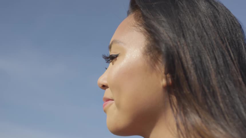 A woman is standing outdoors