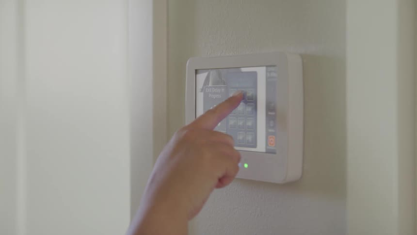 A woman sets her smart device in her home