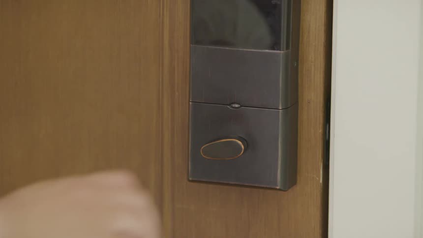 Close up of a person locking a door