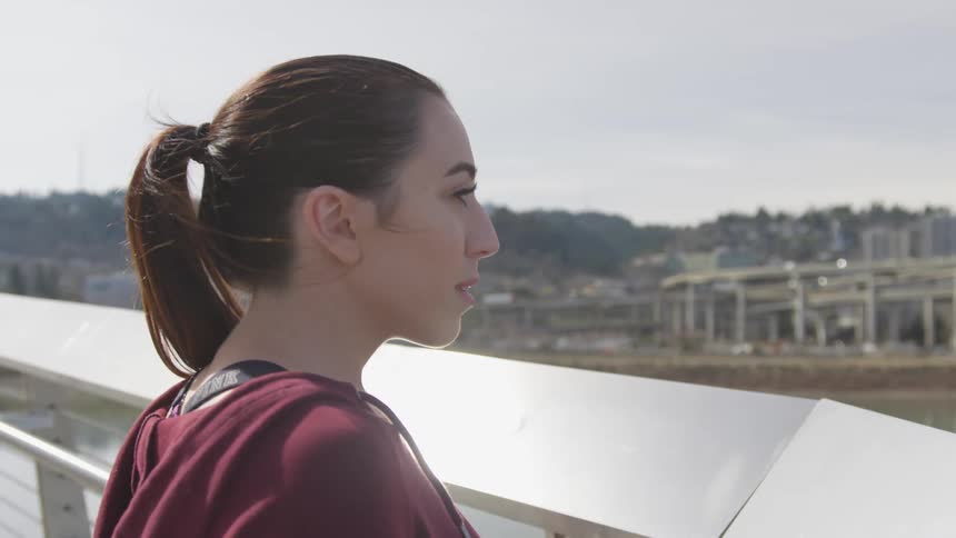 A young woman looking at the city skyline