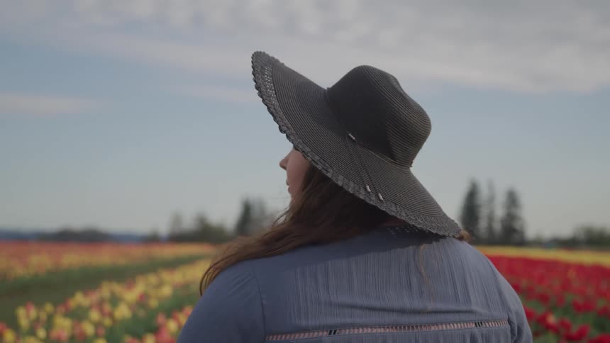 A woman in a field of flowers