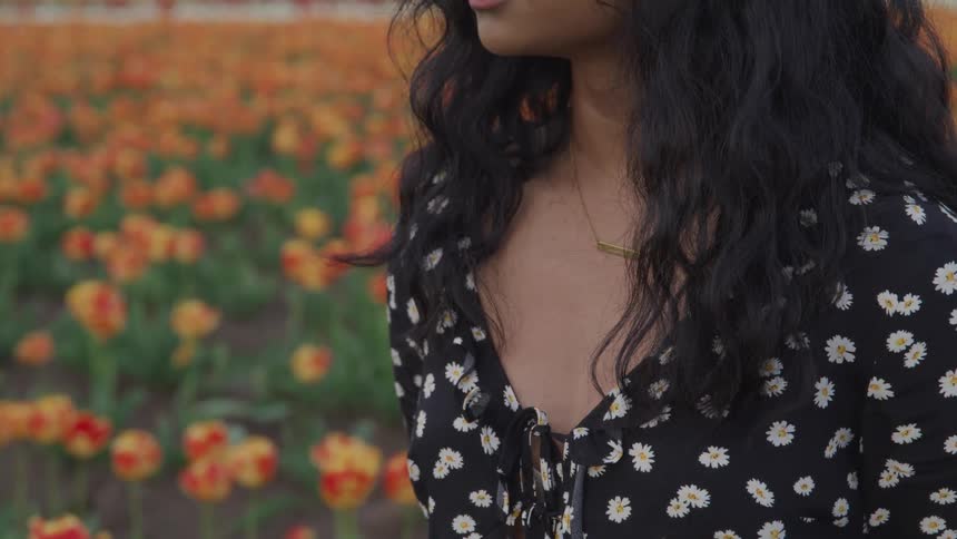 A teenage girl in a field of tulips