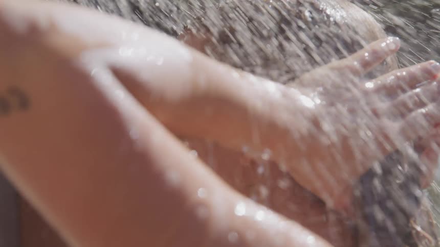A woman is taking a shower