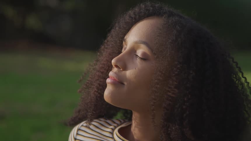 A woman is relaxing outdoors in spring